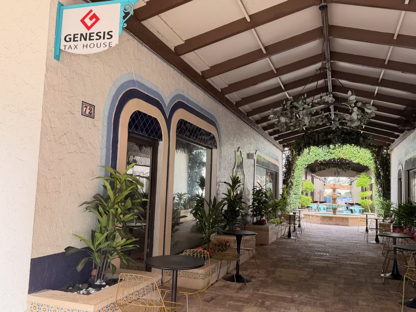 The Genesis Tax House sign in the arcade at Royal Palm Place, Boca Raton