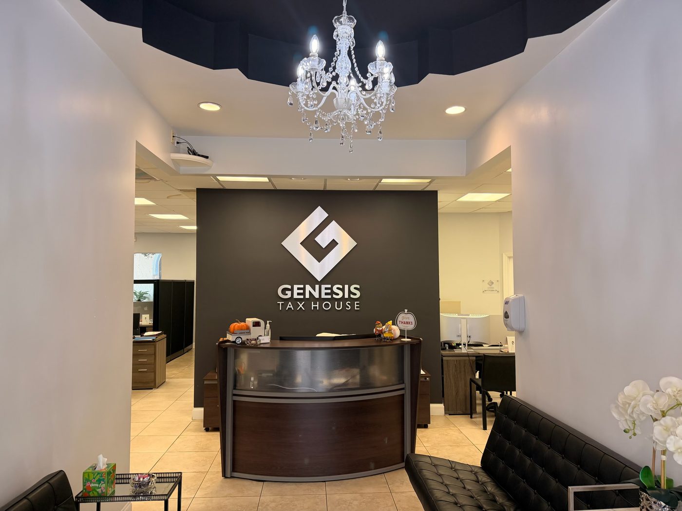 Reception of the Boca Raton office with the Genesis Tax House logo on the wall